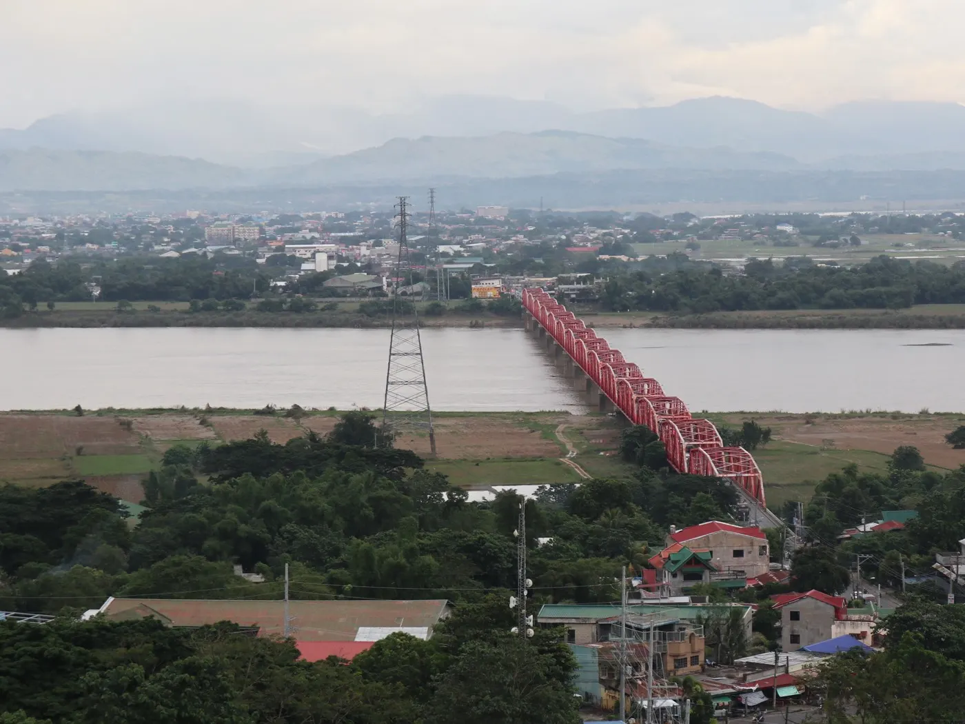 Buntun Bridge crossing the Cagayan River toward Tuguegarao City, with the Sierra Madre in the distance